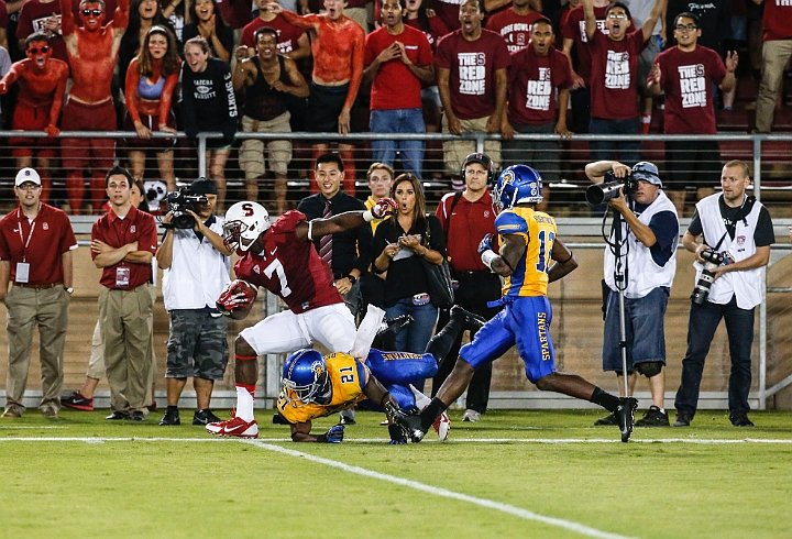 130907-Stanford-SanJose-018.JPG - Sept.7, 2013; Stanford, CA, USA; Stanford Cardinal wide receiver Ty Montgomery (7) is forced out of bounds by  San Jose State Spartans cornerback Bene Benwikere (21) following a 42 yard reception at  Stanford Stadium. Stanford defeated San Jose State 34-13.